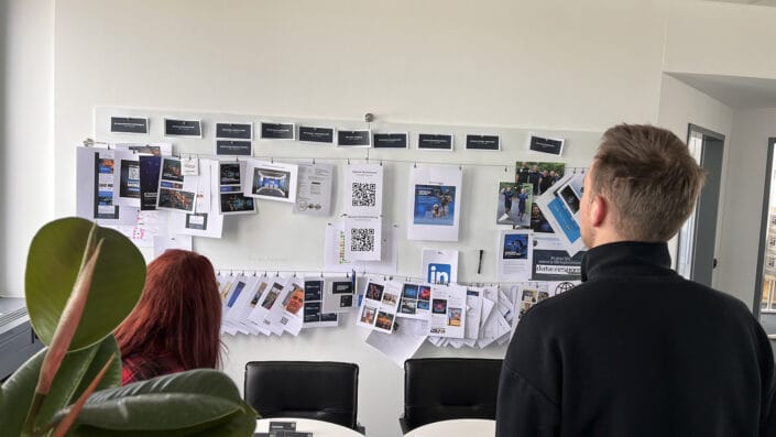 Kati and Roman with a view of the current brand wall